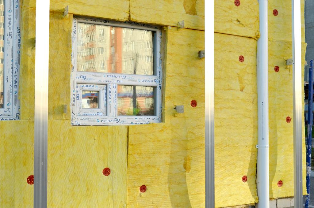 Thomas's home exterior showing new eco-friendly insulation and energy-efficient windows